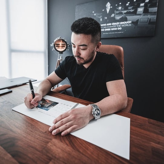 Tom Wang At Desk